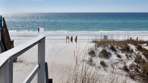 A beach with a wooden boardwalk, sandy beach, and ocean view. - 🌊Beautiful Peek of the Gulf~Pools~Walk2Beach~On the Beach🌊 (Miramar Beach)
