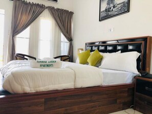 Desk, laptop workspace, free WiFi, bed sheets - Flourish Garden Apartments (Asaba)