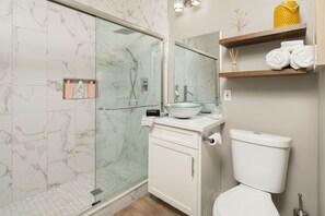 Shower, hair dryer, towels, soap
