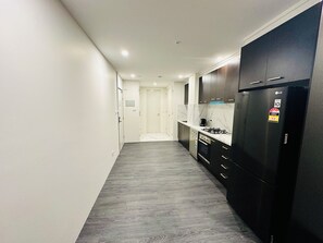 Deluxe One Bedroom Apartment | Private kitchen