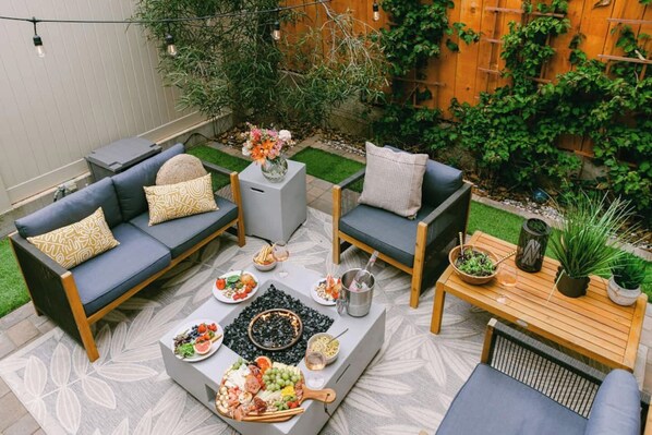 Terrace/patio - Bikes, beach gear, private yard + walk to sand — your OB surf & chill escape awaits. (San Diego)