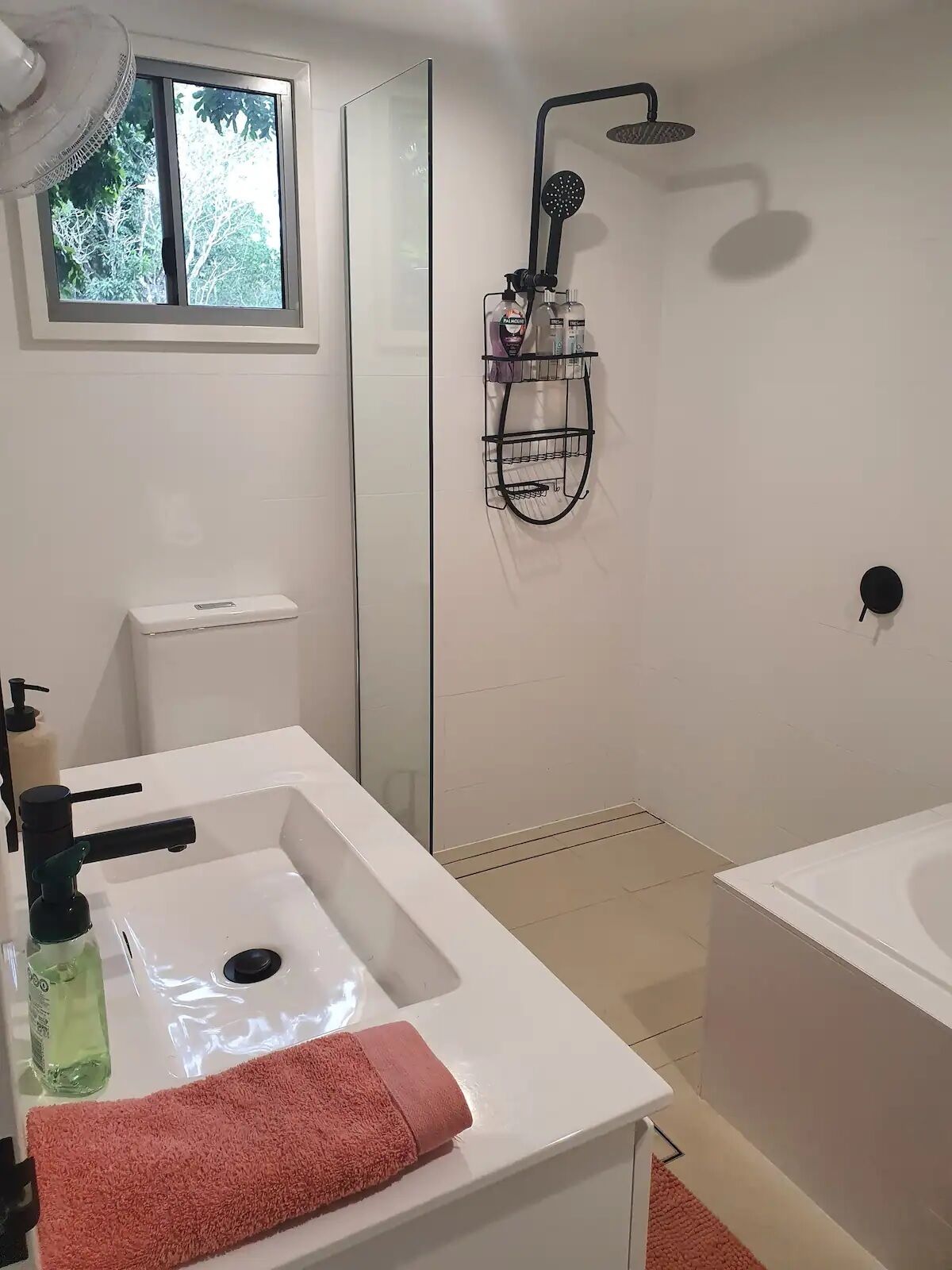 Bathtub, hair dryer, towels, soap