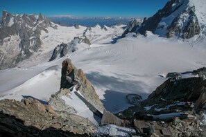 A mountainous landscape with snow-covered peaks and a rocky foreground. - V Buet 53: Beside Ski Lift; Pool, Sauna & Gym, Vallorcine (Argentiere), France (Vallorcine (Argentiere))