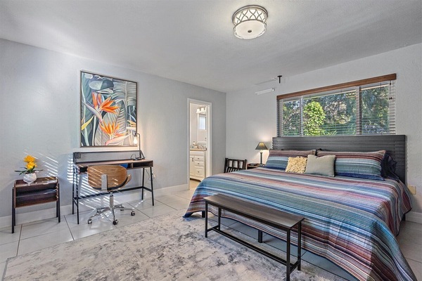 Spacious bedroom with King bed, high quality hotel linen and dedicated workspace