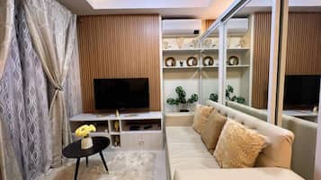 Condo ejecutivo | Área de sala de estar | Smart TV