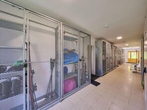 A corridor with metal mesh enclosures, likely for storage or security purposes. - Ski-In Ski-Out Mountain Duplex Portášky2 by Interhome (Pec pod Snezkou)