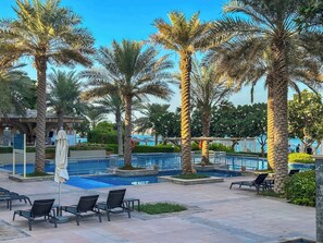 Pool - Upgraded 2BR apartment at the beach - Shoreline 1 (Dubai)