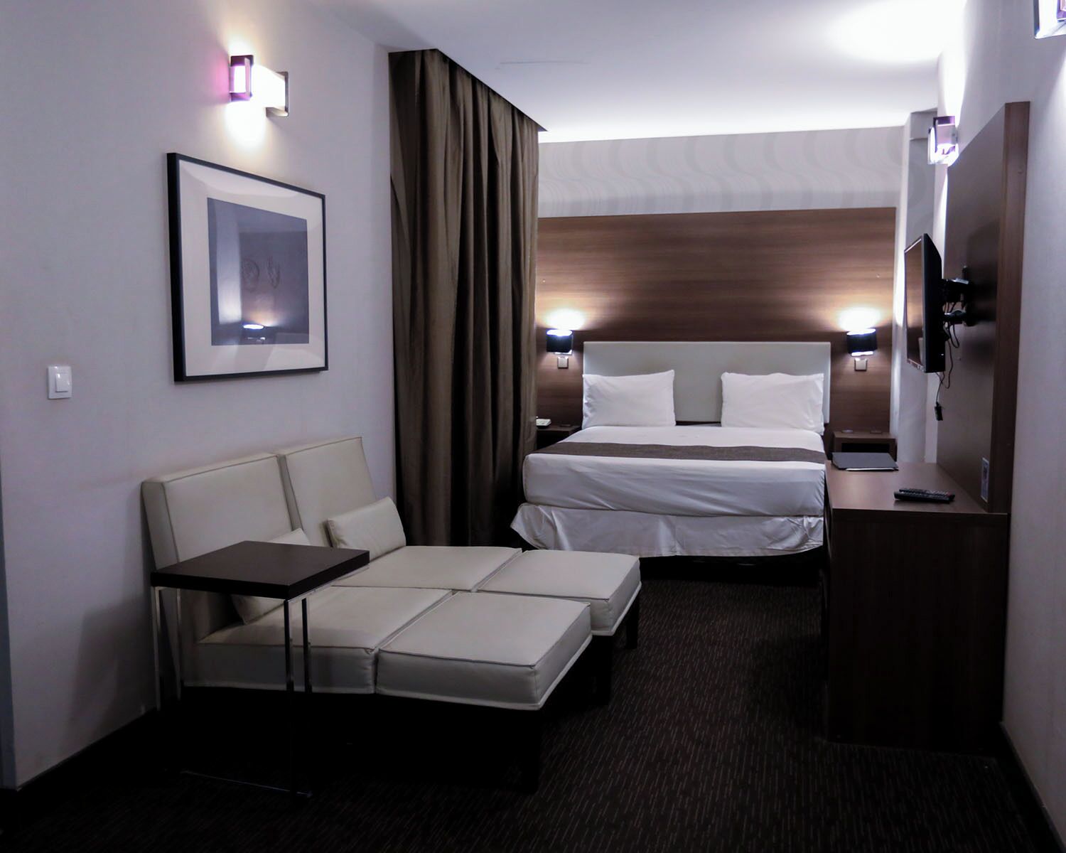 Premium bedding, memory-foam beds, in-room safe, laptop workspace