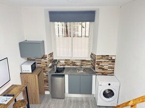 Fridge, microwave, stovetop, coffee/tea maker