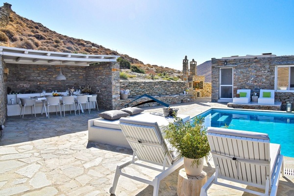 The pool area, villa and the dining area