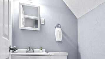 Bathtub, hair dryer, towels