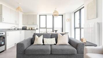 Apartment | Living area | 30-inch TV with cable channels