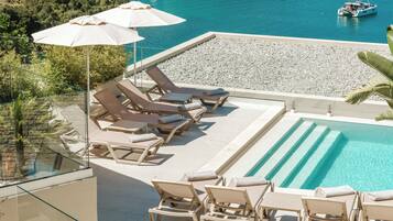 2 outdoor pools, pool umbrellas, sun loungers