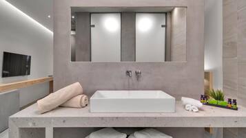 Designer toiletries, hair dryer, bathrobes, slippers