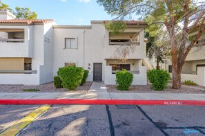 A two-story residential building with a flat roof, a front entrance, and a small balcony. - Walkable 2BR in Old Town w/ Pool + More (Scottsdale)