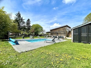 Seasonal outdoor pool, open 8:00 AM to 8:00 PM, pool umbrellas