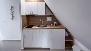 Romantic Apartment (Second Floor Attic (5)) | Private kitchen | Full-size fridge, microwave, electric kettle, toaster - Apartmani Bijelic (Zabljak)