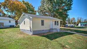 A single-story mobile home with a small porch, a front yard, and a driveway. - Minutes to local attractions, interstates, and places of interest such as JCMC, ETSU, the the VA. (Johnson City)