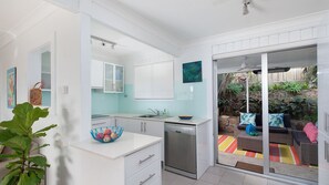 Fridge, microwave, oven, stovetop - Maluhia B is a beautifully maintained pet friendly property just 5 minutes' walk to the beach (Fingal Bay)