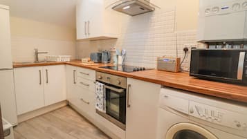 Fridge, electric kettle, toaster, cookware/dishes/utensils
