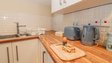 Fridge, electric kettle, toaster, cookware/dishes/utensils