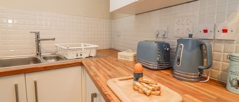 Fridge, electric kettle, toaster, cookware/dishes/utensils