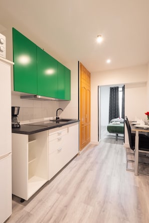 Fridge, microwave, stovetop, coffee/tea maker