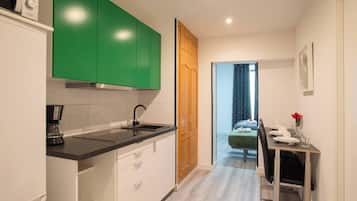 Fridge, microwave, stovetop, coffee/tea maker