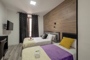 Iron/ironing board, travel crib, free WiFi, bed sheets