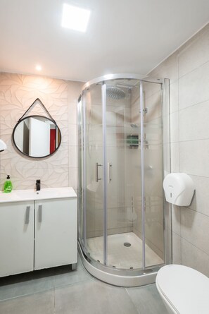 Shower, hair dryer, towels, soap