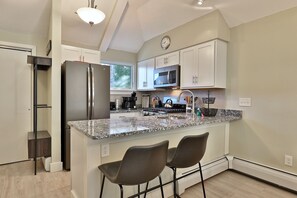 Condo, 2 Bedrooms | Private kitchen | Fridge, oven, coffee/tea maker, toaster - The Woods by Killington Vacation Rentals - 2 Bedrooms (Killington)