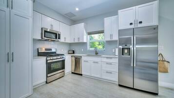 Microwave, dishwasher, dining tables
