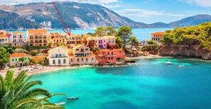A coastal town with colorful buildings and a clear view of the sea.