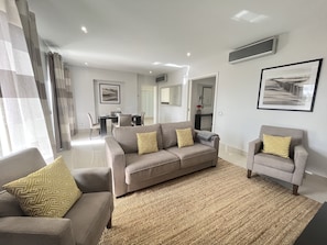 Comfort Apartment | Living area | 32-inch plasma TV with cable channels, TV