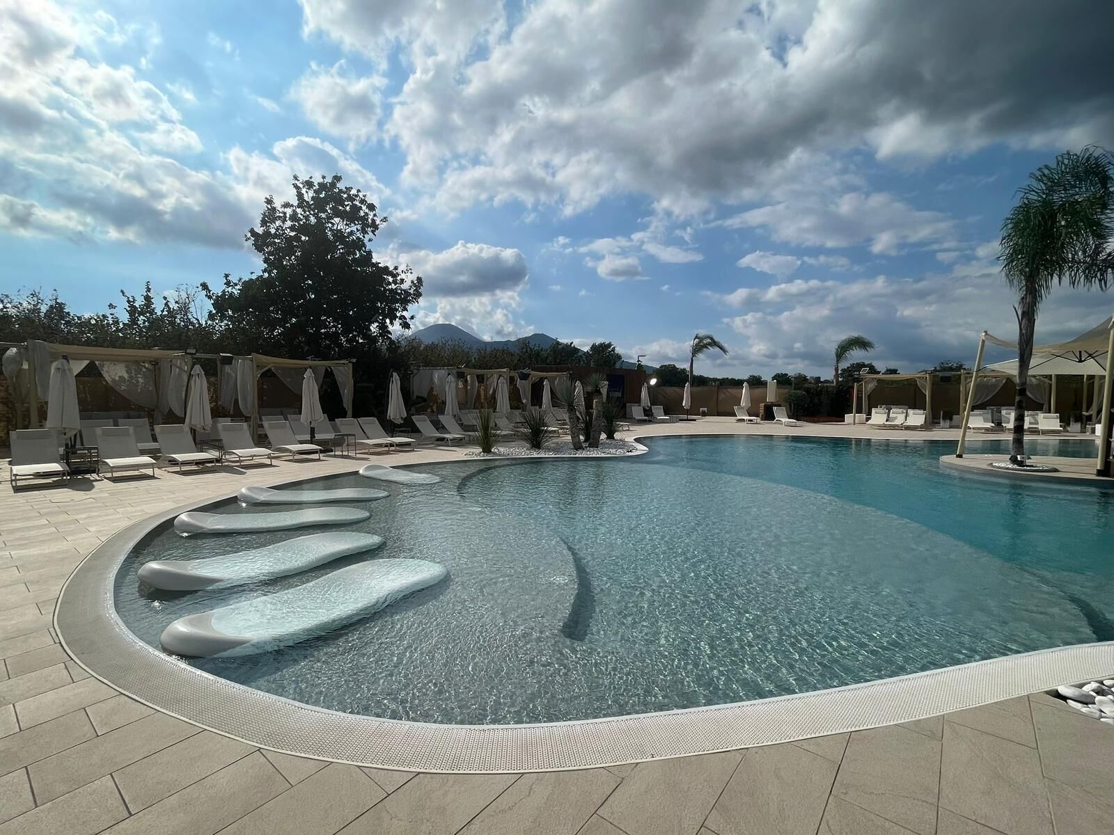 Seasonal outdoor pool, open 8:00 PM to 10:00 PM, pool umbrellas
