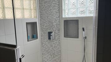Shower, hair dryer, heated floors, towels