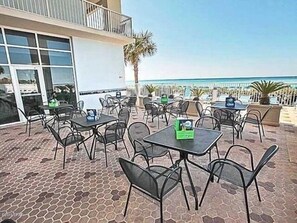 Relax in a tranquil outdoor space with a balcony overlooking the beach.