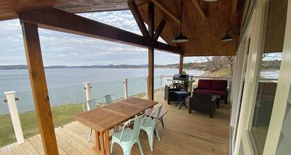 Welcome to 54 West Lake Shore Drive, a charming, single-floor home near the peaceful shores of Lake Champlain. This 1,200-square-foot residence offers 2 bedrooms (1 King, 1 Queen), 1.5 bathrooms with a shower and soaker tub. The thoughtfully designed