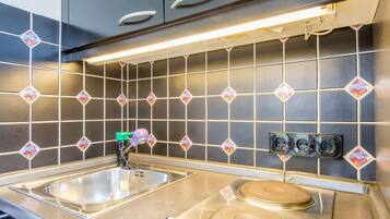 Fridge, coffee/tea maker, toaster, cookware/dishes/utensils