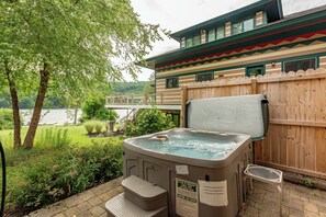 Outdoor spa tub - Cozy Lakefront Escape w/ Sauna, Swim Spa & Views (McHenry)
