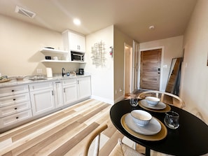 Fridge, microwave, stovetop, coffee/tea maker
