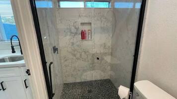 Shower, hair dryer, towels, soap