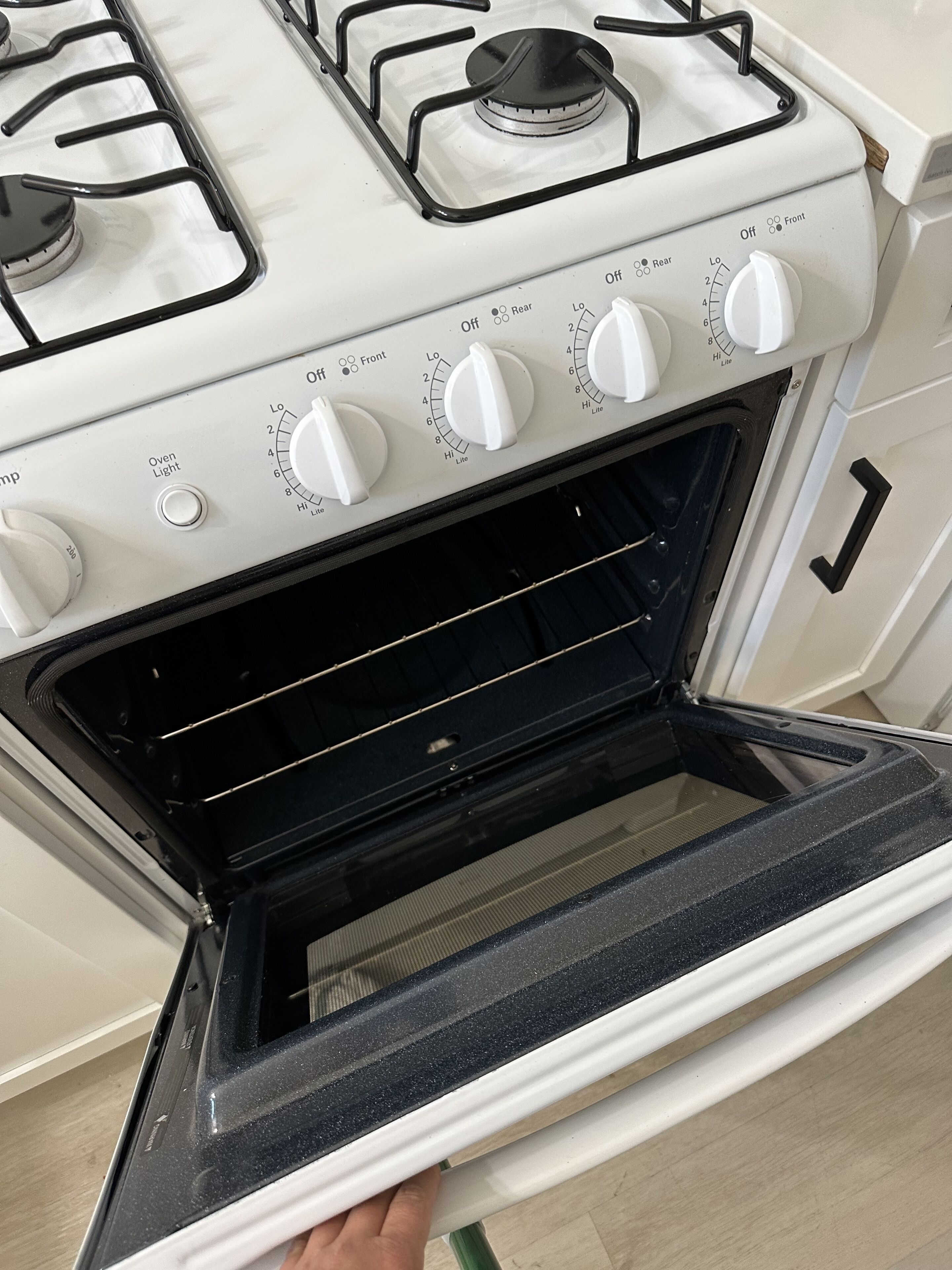 A kitchen with a stove and an oven.