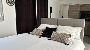 Iron/ironing board, travel crib, free WiFi, bed sheets