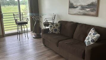 Luxury Studio Suite, 1 Bedroom, Golf View | Living area | 55-inch plasma TV with cable channels