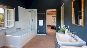 Bathtub, hair dryer, bidet, towels