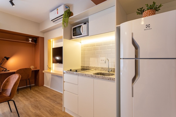 Full-size fridge, microwave, stovetop, cookware/dishes/utensils