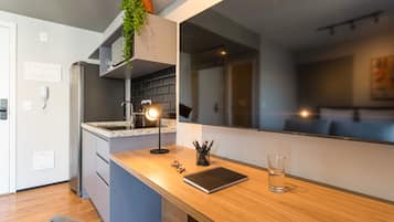 Full-size fridge, microwave, stovetop, cookware/dishes/utensils