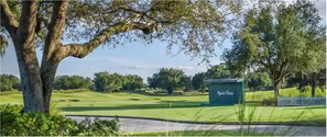 Enjoy a serene golfing experience amidst lush greenery and mature trees at Mystic Dunes.