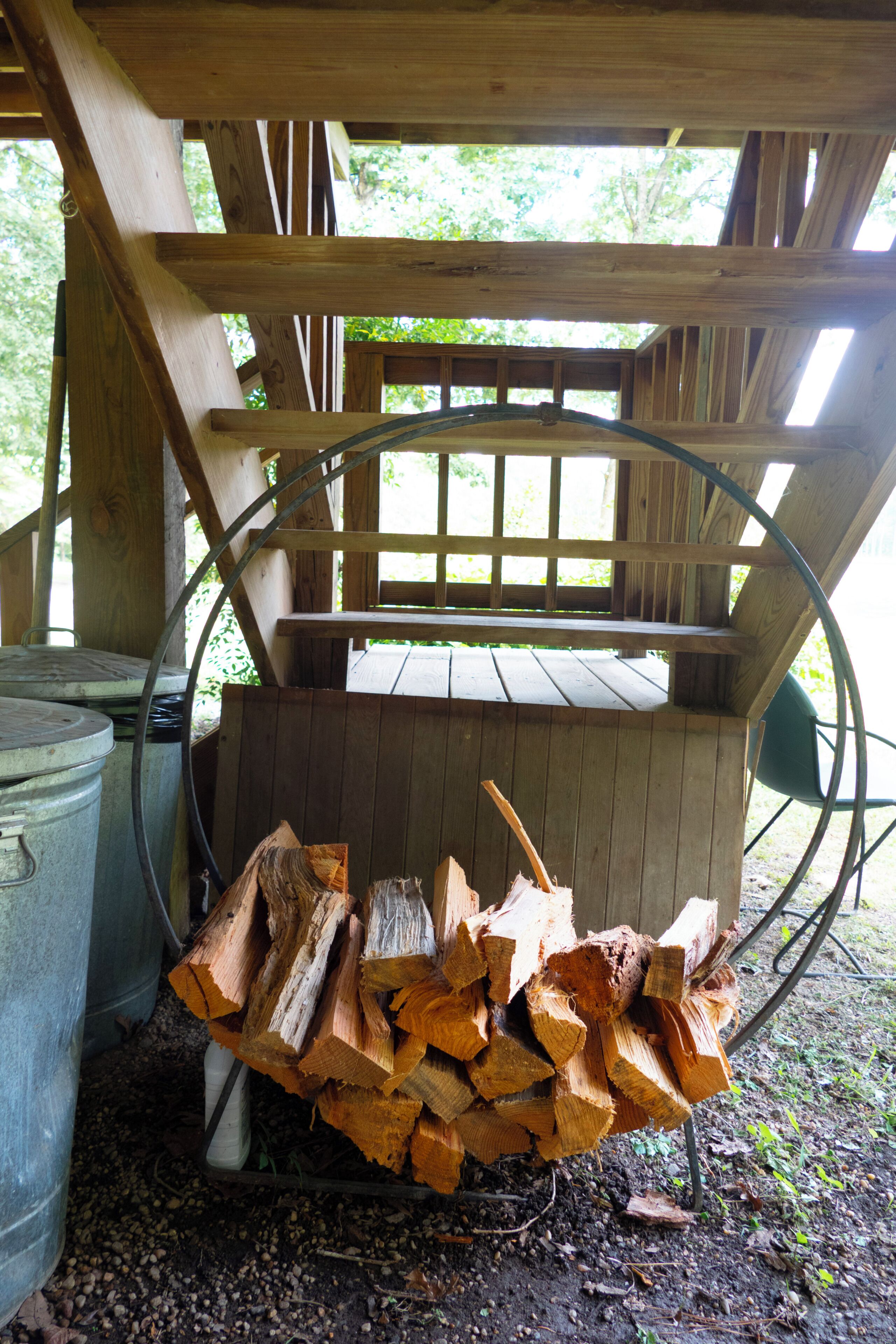 A rustic wooden structure with a metal spiral staircase.